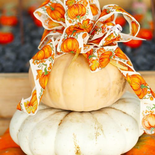 stacked pumpkins with decorative bow