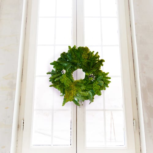 decorative christmas wreath on window