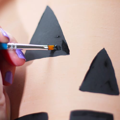 painting jack o lantern face on pottery