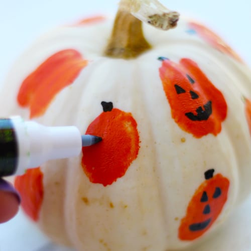 Drawing Ghost Face on Pumpkin for Fall Decoration | Calloway’s Nursery 